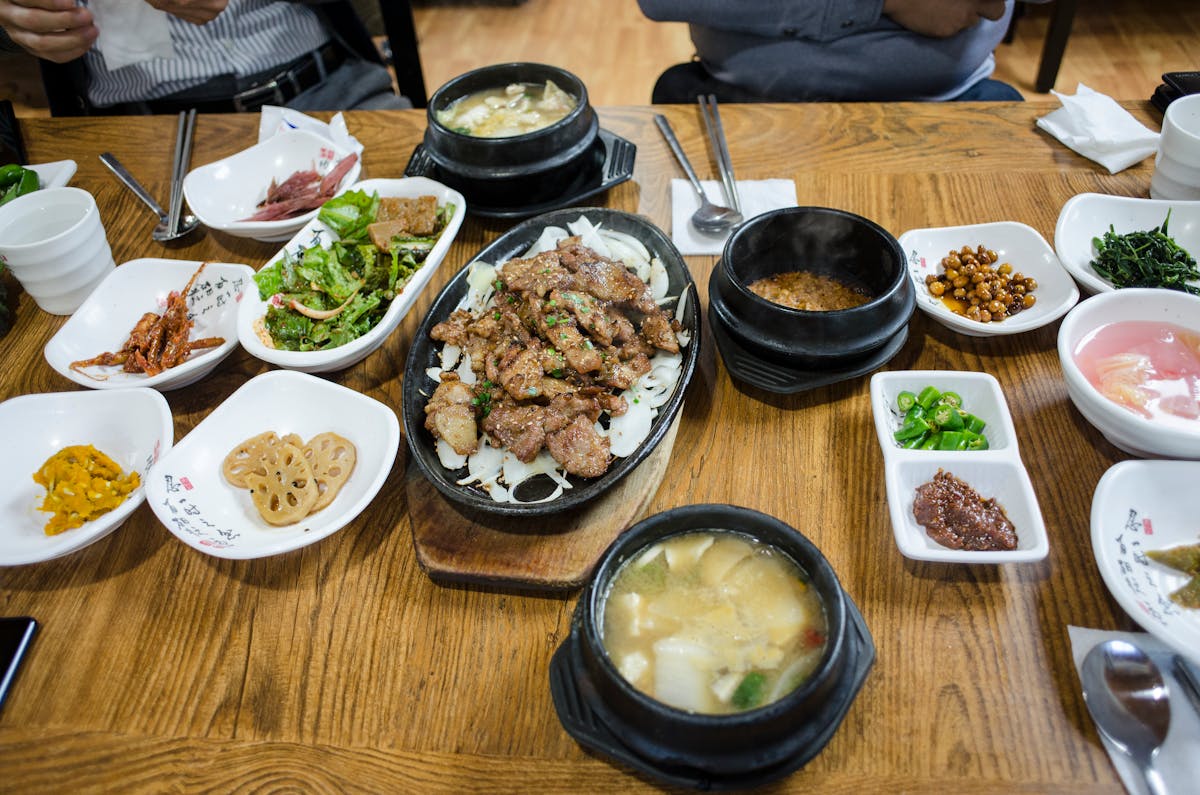 Assortment of authentic Korean dishes served on restaurant table
