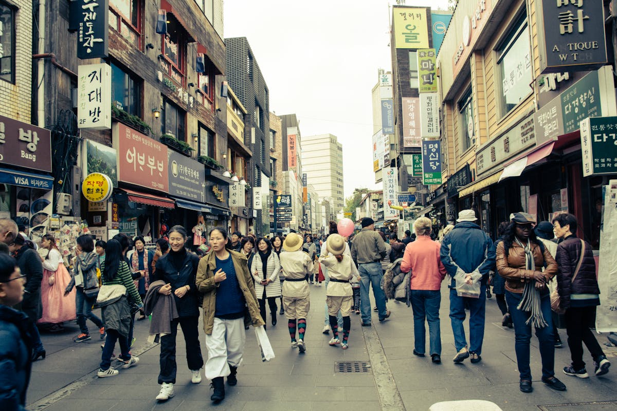 Colorful Korean street with people and local shop signs
